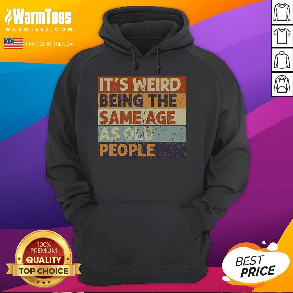Funny vintage hoodie design: 'It's weird being the same age as old people' with a sarcastic twist, perfect for humor lovers.