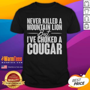 Funny Never Killed A Mountain Lion But I've Choked A Cougar T-Shirt design featuring a humorous graphic and bold text.