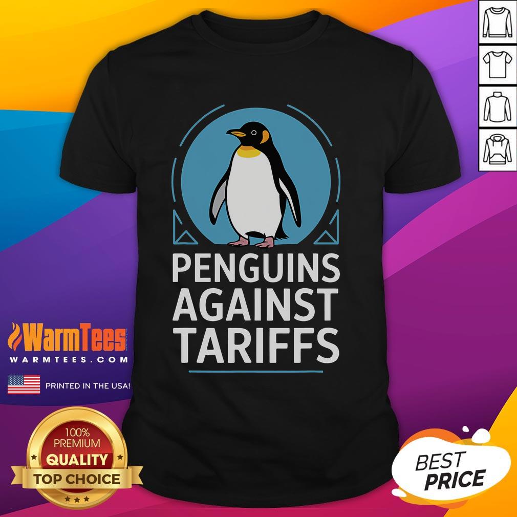 Funny penguins wearing protest signs against tariffs on a humorous T-shirt design, showcasing lively activism.