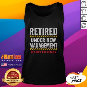 Funny retired husband wearing a humorous retirement tank top at his retirement party, celebrating a new chapter in life.