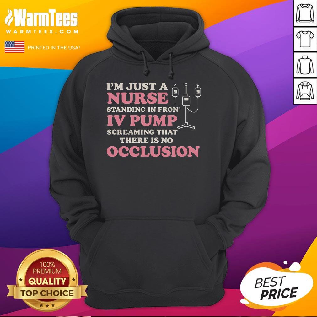 Good I'm Just A Nurse hoodie worn by a nurse standing in front of an IV pump, showcasing healthcare pride and professionalism.