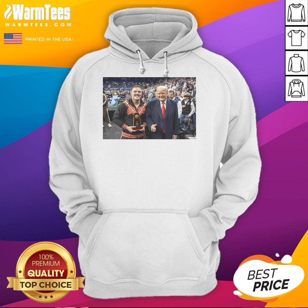 Alt Text: Wyatt Hendrickson wearing a hoodie featuring Donald Trump, showcasing his status as a wrestling legend in USA.