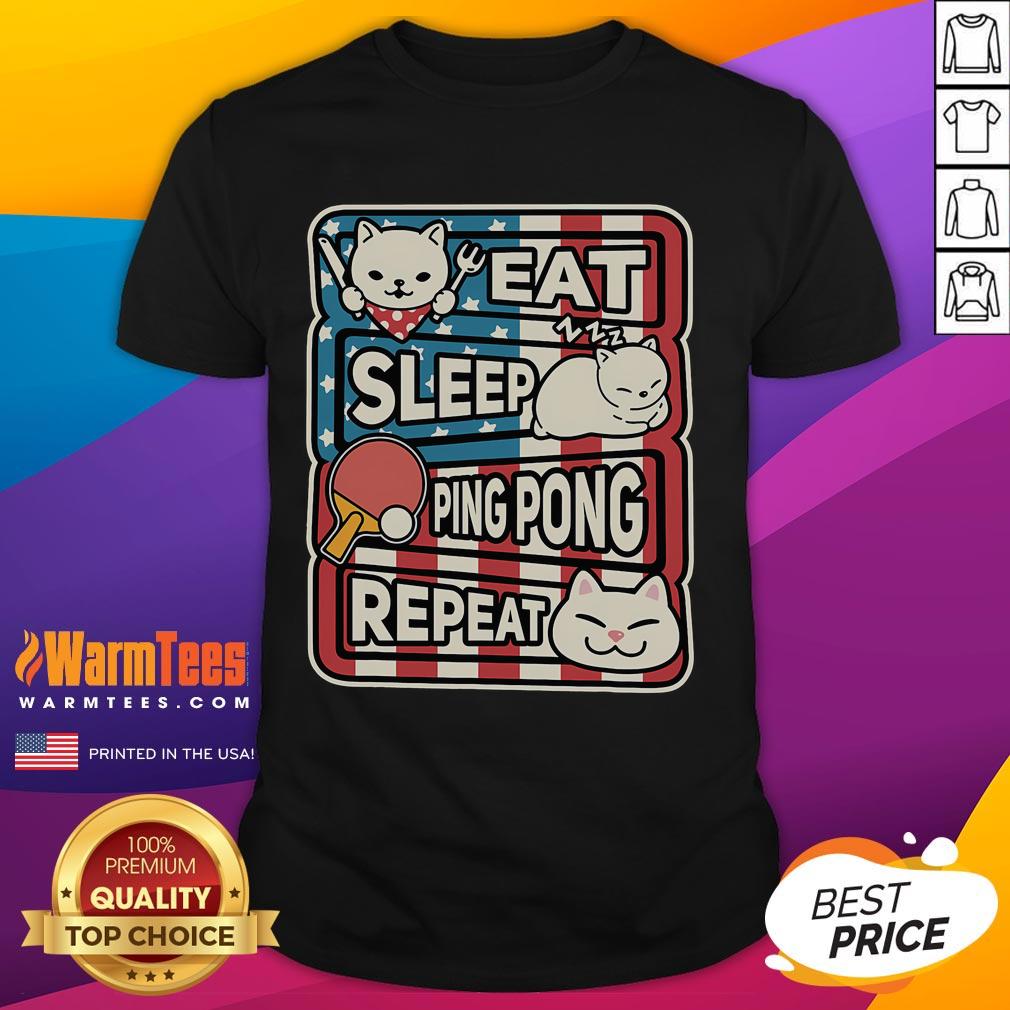 Patriotic table tennis t-shirt featuring a cute cat with the phrase 'Eat Sleep Ping Pong Repeat' in vibrant colors.