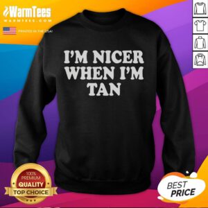 Stylish 'Official I'm Nicer When I'm Tan' sweatshirt in a cozy setting, perfect for casual wear and summer vibes.