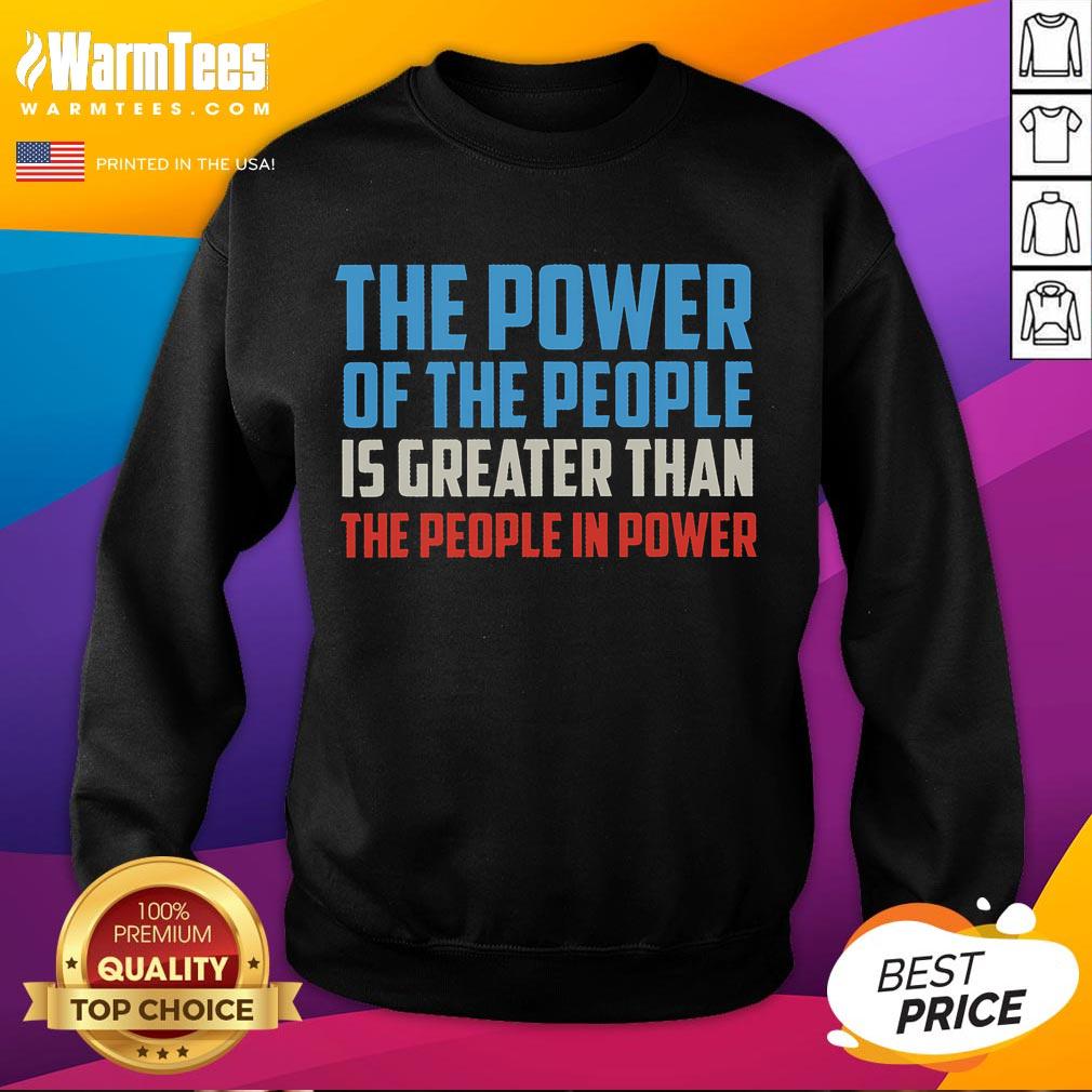 Alt Text: Cozy sweatshirt featuring The Power Of The People Is Greater Than The People In Power slogan for activism.