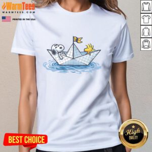 Alt Text: Cute Snoopy sailing in a paper boat on a ladies tee, perfect for fans of whimsical and playful graphic shirts.