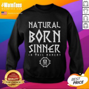 Alt Text: Model wearing Good In This Moment Natural Born Sinner sweatshirt in a cozy urban setting, showcasing stylish streetwear.