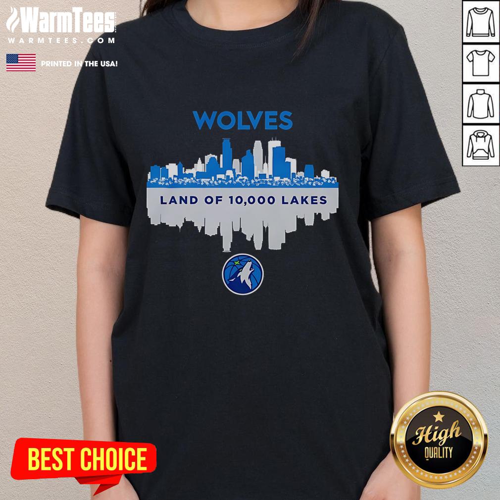 Stylish ladies tee featuring the Minnesota Timberwolves skyline and 'Land of 10,000 Lakes' design for fans.
