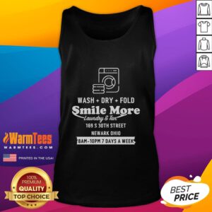Happy Roman Atwood in a 'Just Methin Around' tank top, smiling while doing laundry in Newark, Ohio.