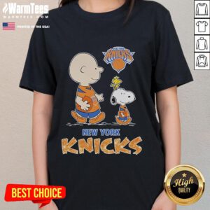 Ladies tee featuring Snoopy and Charlie Brown from The Peanuts in New York Knicks colors, perfect for fans.