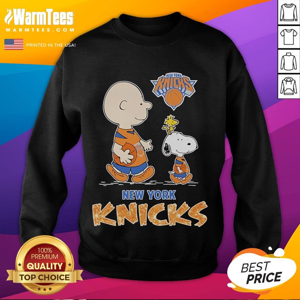 Snoopy and Charlie Brown on a New York Knicks sweatshirt, perfect for Peanuts fans and sports apparel collectors.