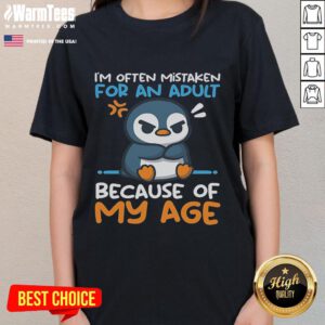 Adorable penguin design on a ladies tee, often mistaken for an adult due to its charming appearance and playful vibe.