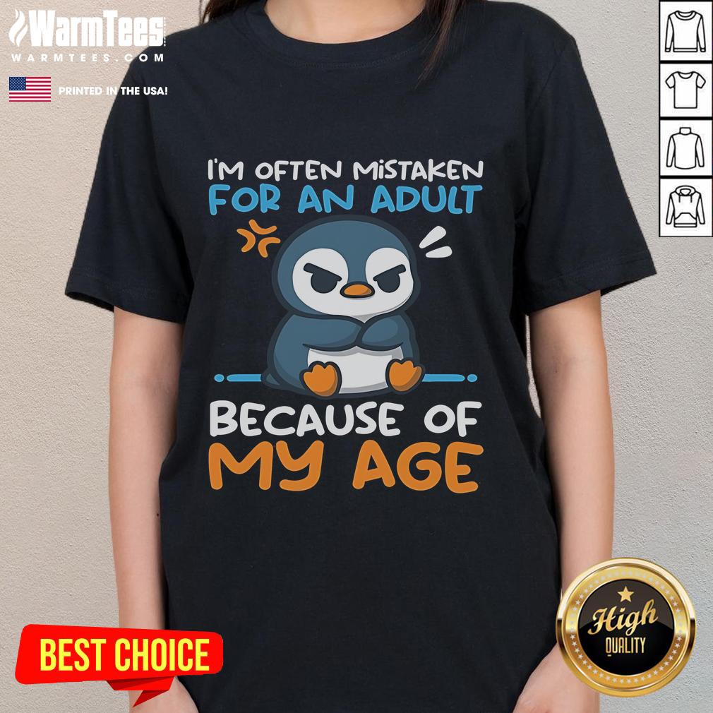 Adorable penguin design on a ladies tee, often mistaken for an adult due to its charming appearance and playful vibe.
