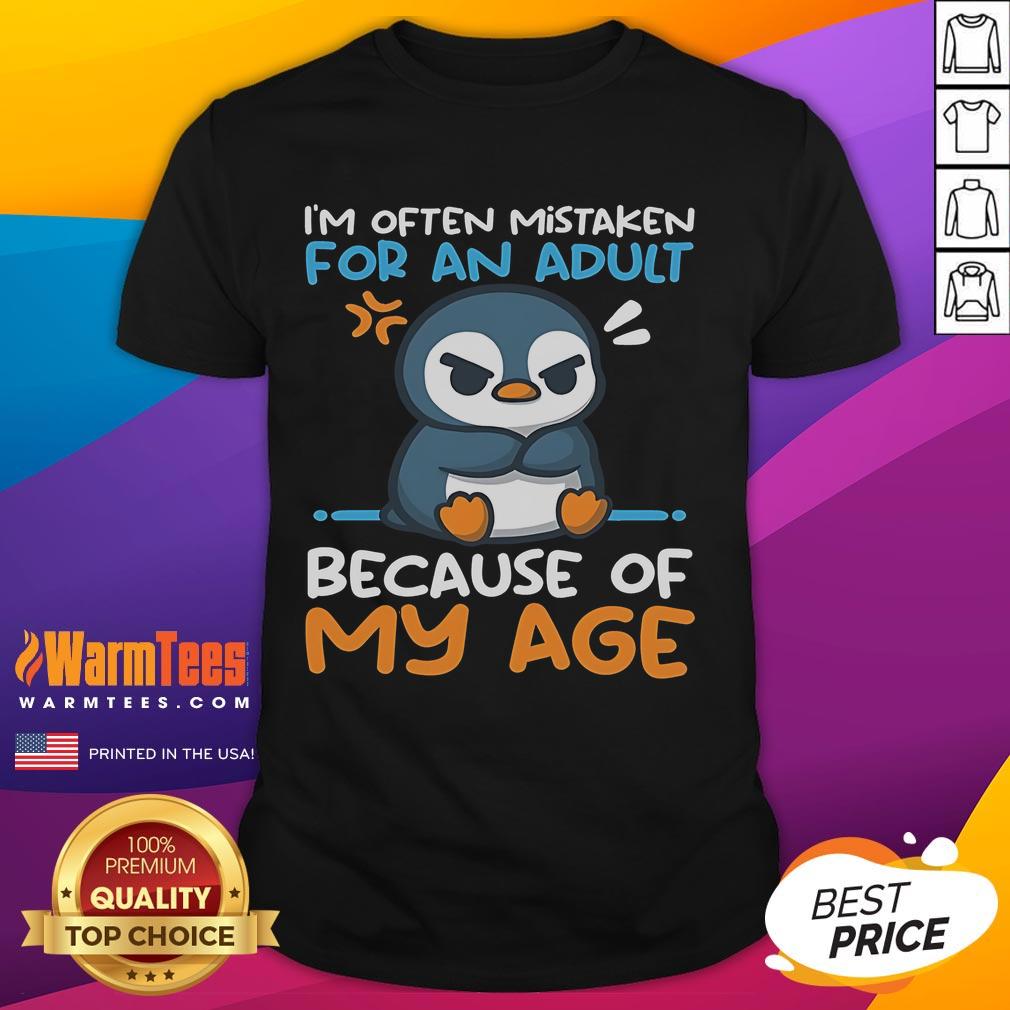 Cute penguin graphic on a T-shirt, humorously labeled 'Often Mistaken For An Adult Because Of My Age.' Perfect for penguin lovers!