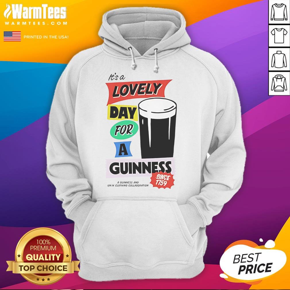 Good It's a Lovely Day for a Guinness hoodie worn outdoors, showcasing a cozy design perfect for casual wear.