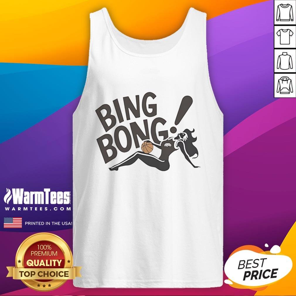 Girl wearing a 'Good San Antonio Spurs' tank top, showcasing team spirit and style at a basketball game.