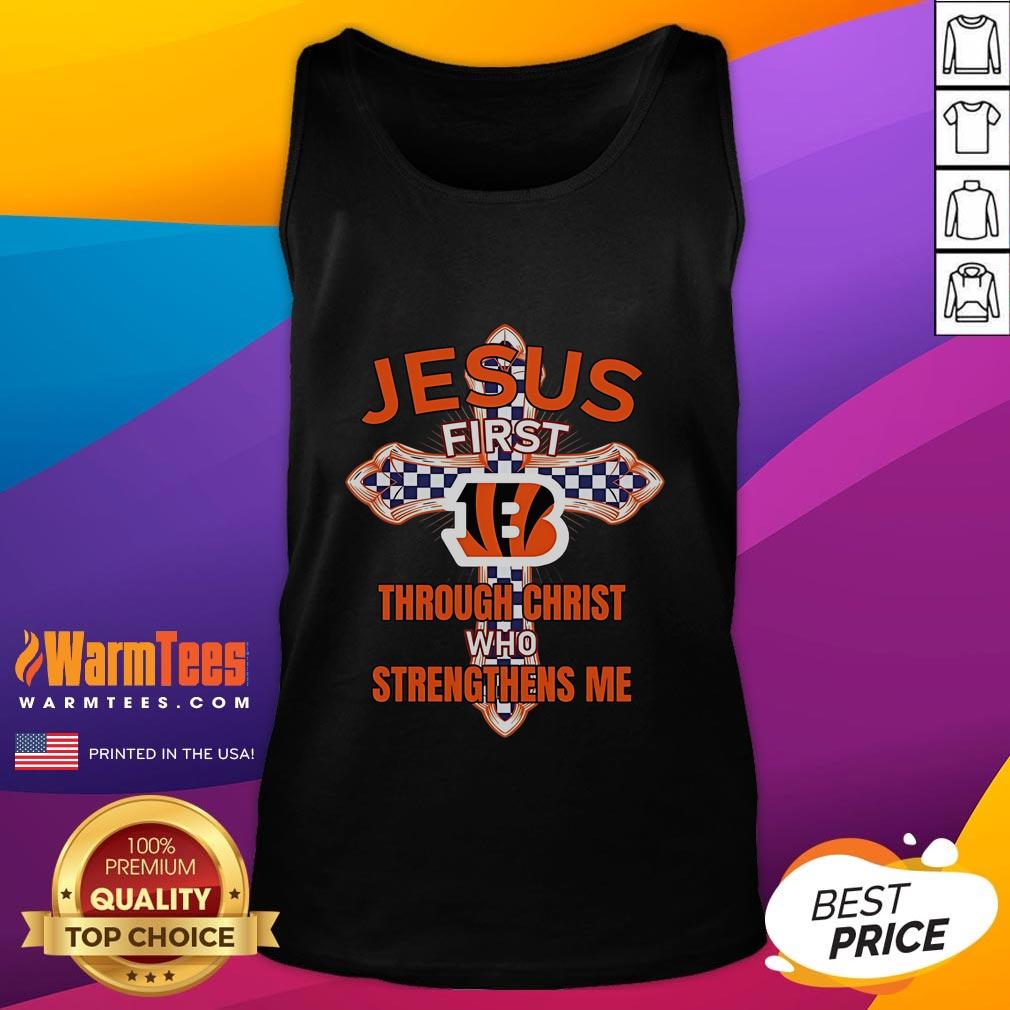 Alt Text: Happy Cincinnati Bengals fan wearing Jesus First tank top, showcasing faith and team spirit at a game.