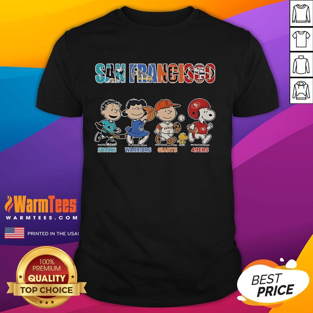Alt Text: Official Peanuts T-Shirt featuring San Francisco Sharks, Warriors, Giants, and 49ers logos, perfect for sports fans.