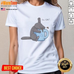 Cute cat playfully drowning in a coffee cup, featured on an I'm Ok ladies tee, perfect for cat lovers and coffee enthusiasts.