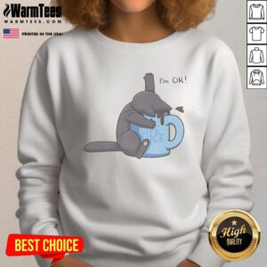 Alt Text: Cute cat drowning in a coffee cup on a cozy sweatshirt, featuring the phrase 'I'm OK' for cat lovers.