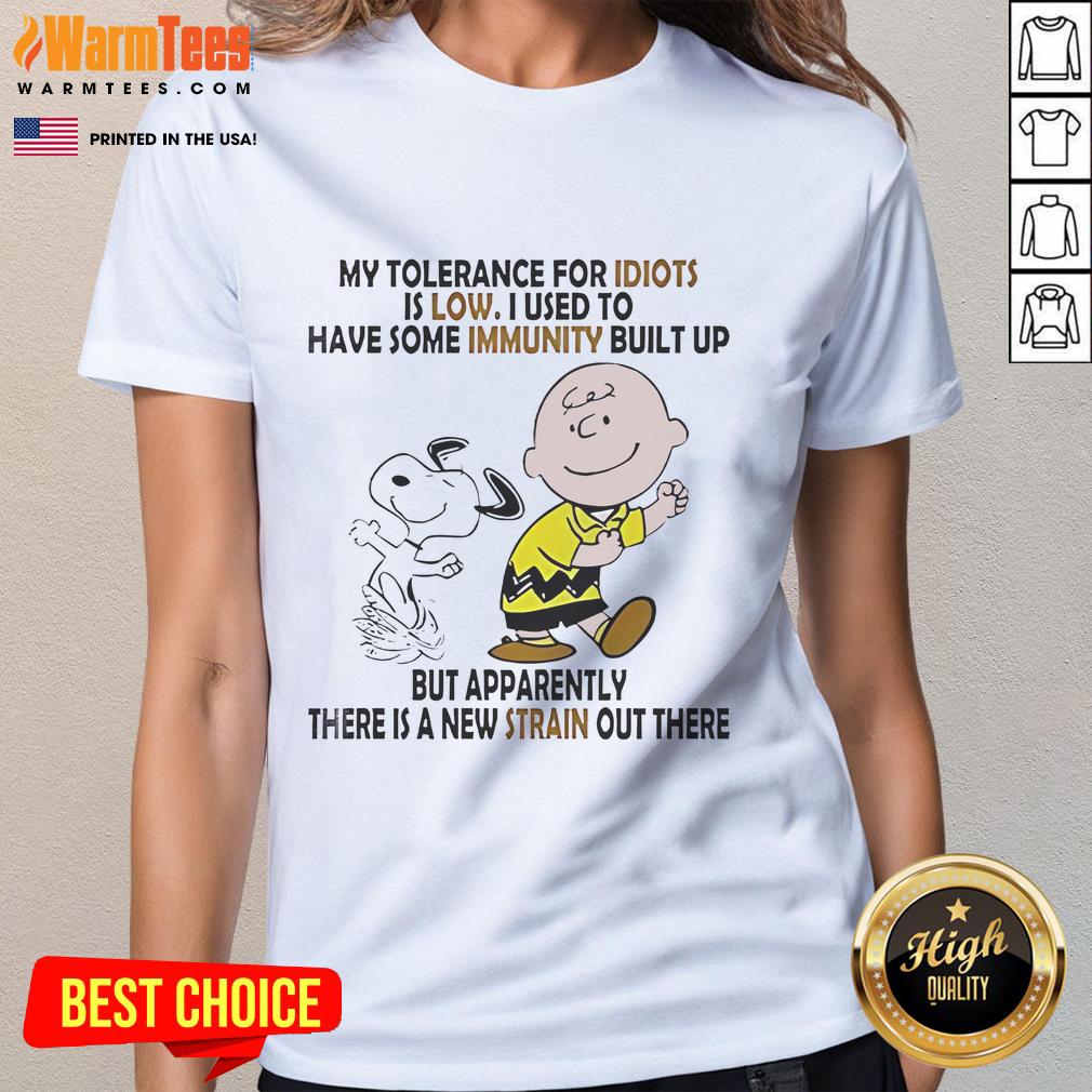 Funny Snoopy and Charlie Brown graphic on a ladies tee, featuring the phrase 'My tolerance for idiots is low'.