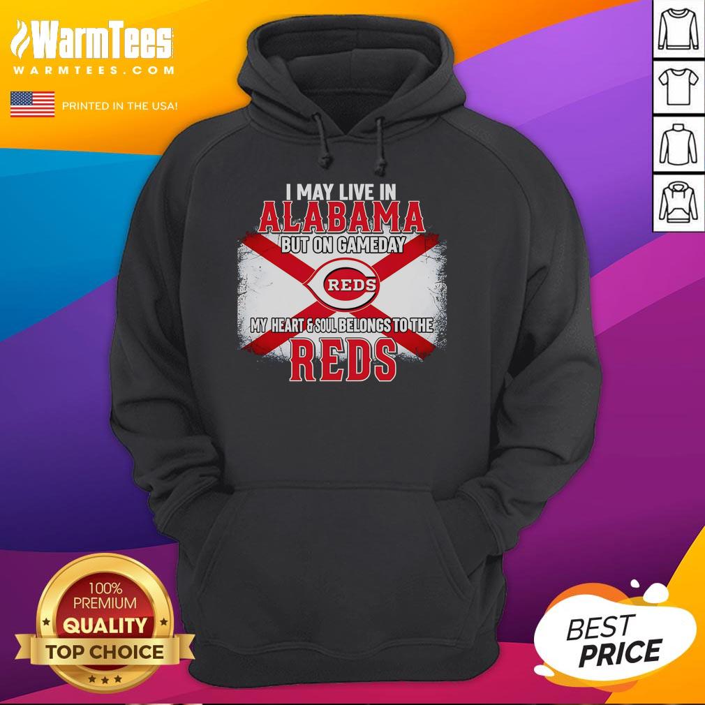 Person wearing a Reds hoodie, showcasing team spirit in Alabama on game day, highlighting loyalty to the Reds.