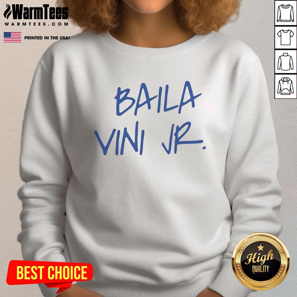 Eduardo Camavinga wearing a stylish Baila Vini Jr sweatshirt, showcasing his trendy fashion and football passion.