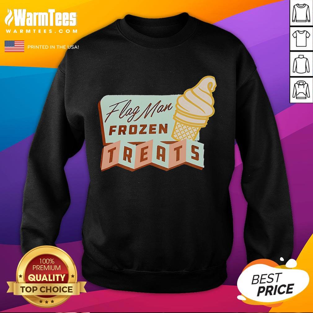 Man wearing Nice Flag sweatshirt, enjoying frozen treats at a vibrant outdoor event.
