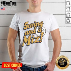 Alt Text: Jacob Misiorowski of the Milwaukee Brewers swings with a Miz T-shirt, showcasing his baseball skills on the field.