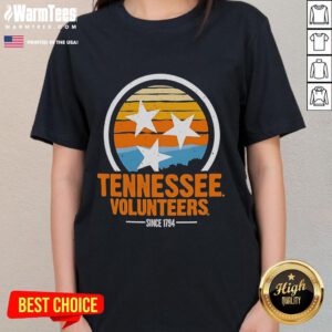 Alt Text: Vintage ladies tee featuring the official Tennessee Volunteers logo, established since 1794, perfect for fans.