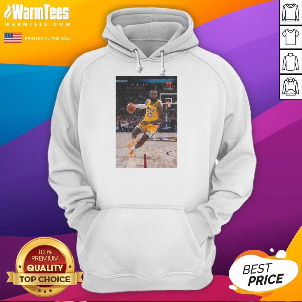 Alt Text: LeBron James in a striking pose wearing a Los Angeles Lakers hoodie, showcasing his iconic Number 23 jersey.