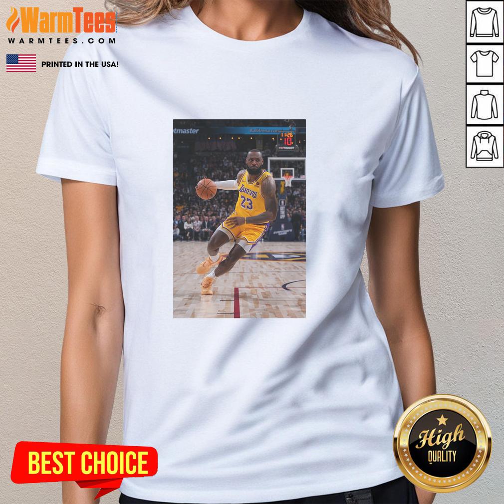 LeBron James in a striking pose wearing a Los Angeles Lakers jersey number 23 on a stylish ladies tee.