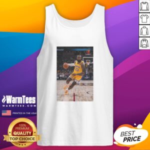 LeBron James in a striking pose wearing a Los Angeles Lakers tank top, showcasing his number 23 jersey.