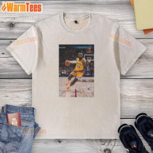 LeBron James in a superstar pose wearing a Los Angeles Lakers Number 23 washed t-shirt, showcasing his basketball style.