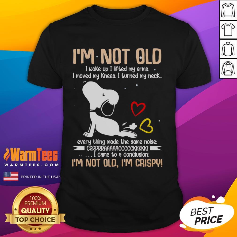 Alt Text: Cute Snoopy graphic t-shirt with I'm Not Old I Woke Up I Lifted My Arms text, perfect for dog lovers and Peanuts fans.