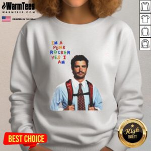 Alt Text: David Corenswet wearing a 'I'm A Punk Rocker Yes I Am' sweatshirt, showcasing a humorous punk style.