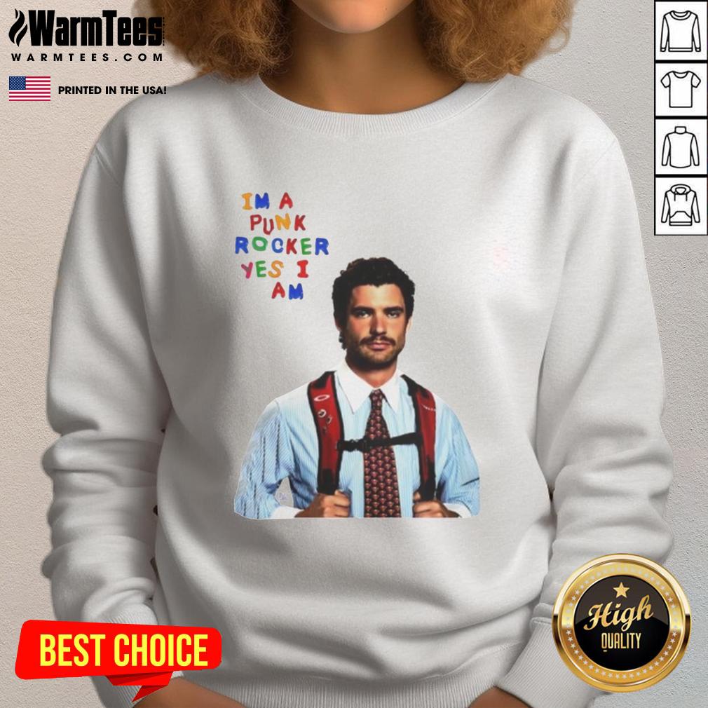 Alt Text: David Corenswet wearing a 'I'm A Punk Rocker Yes I Am' sweatshirt, showcasing a humorous punk style.