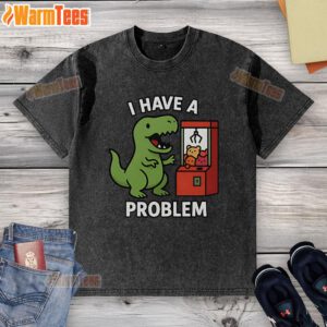Funny T-Rex graphic on a washed t-shirt, featuring a playful claw machine theme for arcade gamers. Perfect for casual wear!
