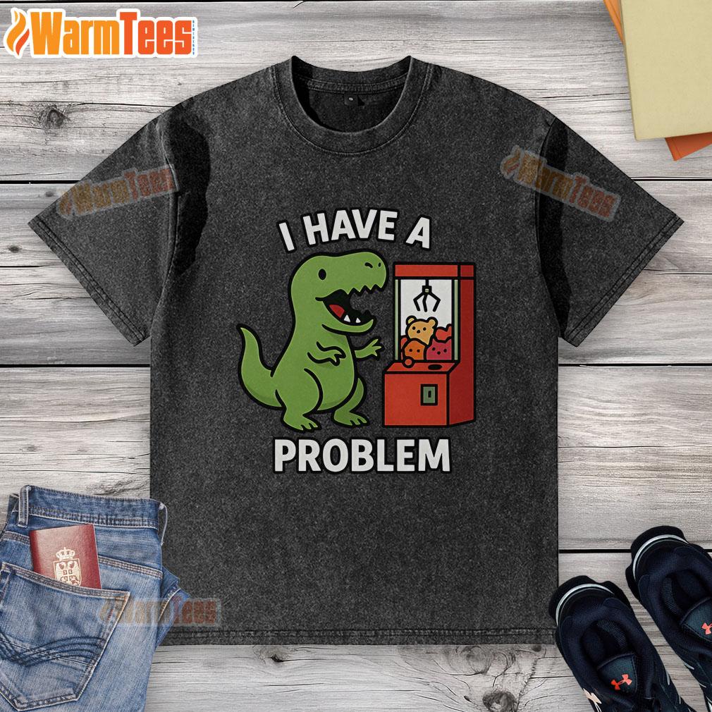 Funny T-Rex graphic on a washed t-shirt, featuring a playful claw machine theme for arcade gamers. Perfect for casual wear!