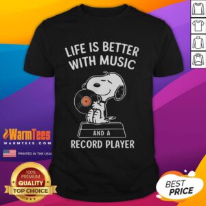 Alt Text: Happy Snoopy wearing a 'Life Is Better With Music' T-shirt, featuring a vintage record player design.