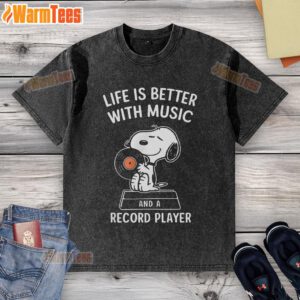 Happy Snoopy on a washed t-shirt with 'Life is better with music and a record player' design, perfect for music lovers.
