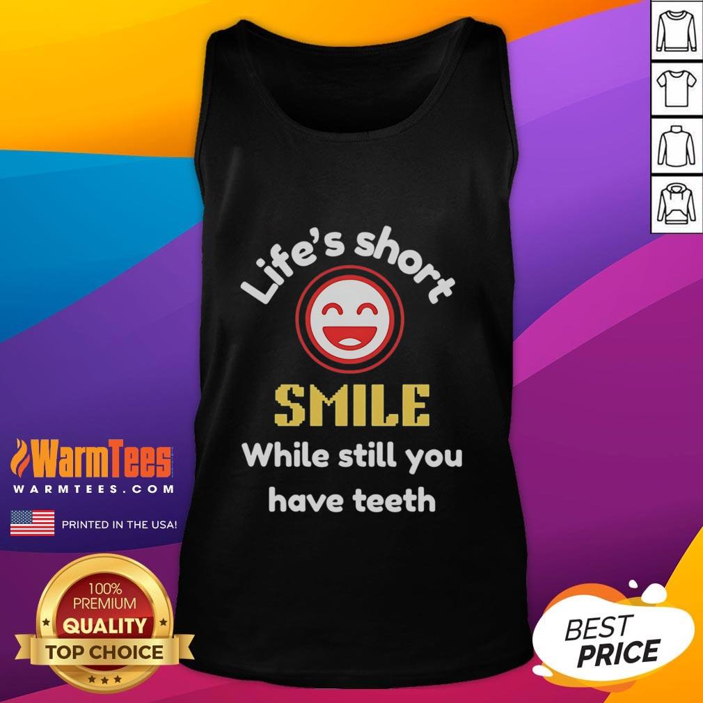 Stylish tank top with 'Life's Short, Smile While You Still Have Teeth' graphic, perfect for casual summer wear.