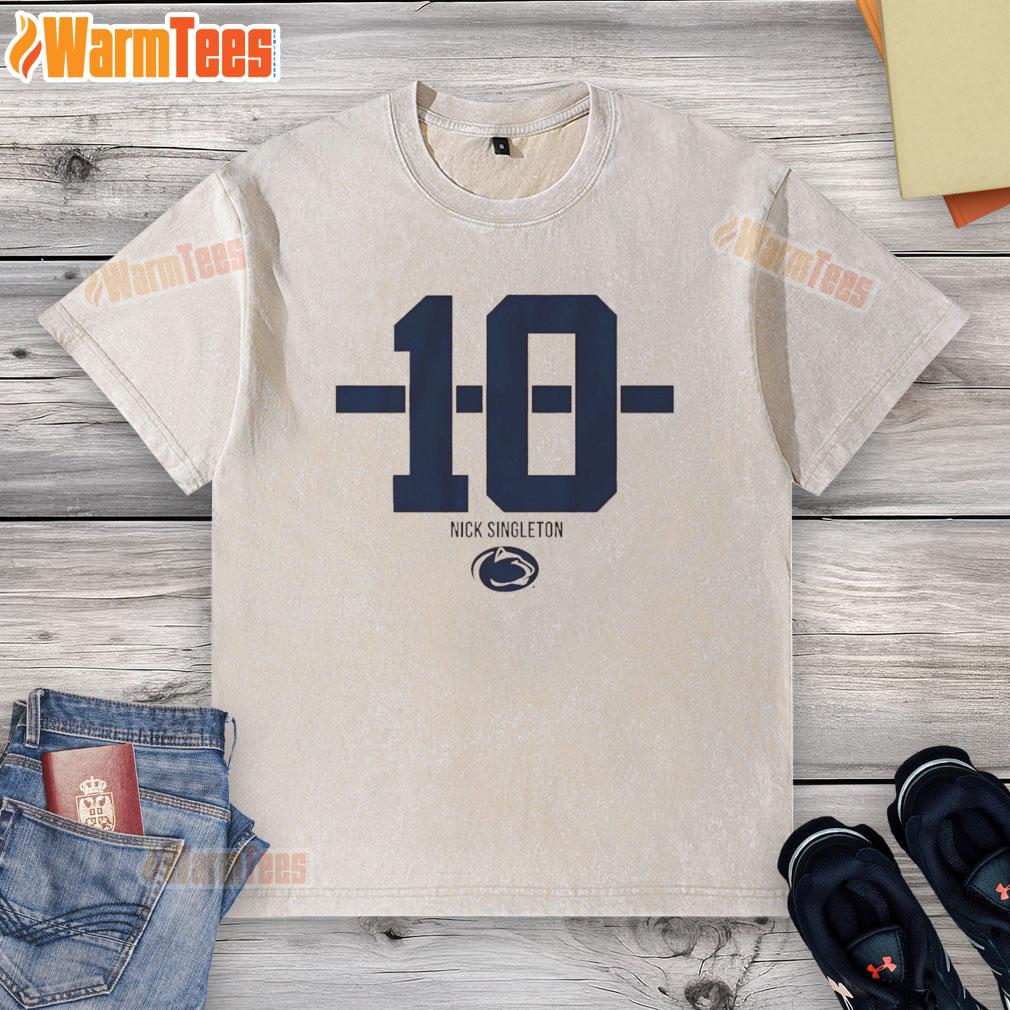 Alt Text: Nicholas Singleton wearing a Penn State Nittany Lions football striped washed t-shirt, showcasing team spirit.