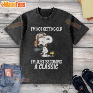 Nice Snoopy 'I'm Not Getting Old, I'm Just Becoming A Classic' washed t-shirt featuring iconic Snoopy graphic design.