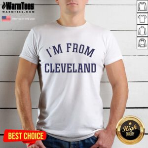 Alt Text: Travis Kelce smiling in a stylish I'M From Cleveland t-shirt, showcasing his love for Cleveland and sports fashion.
