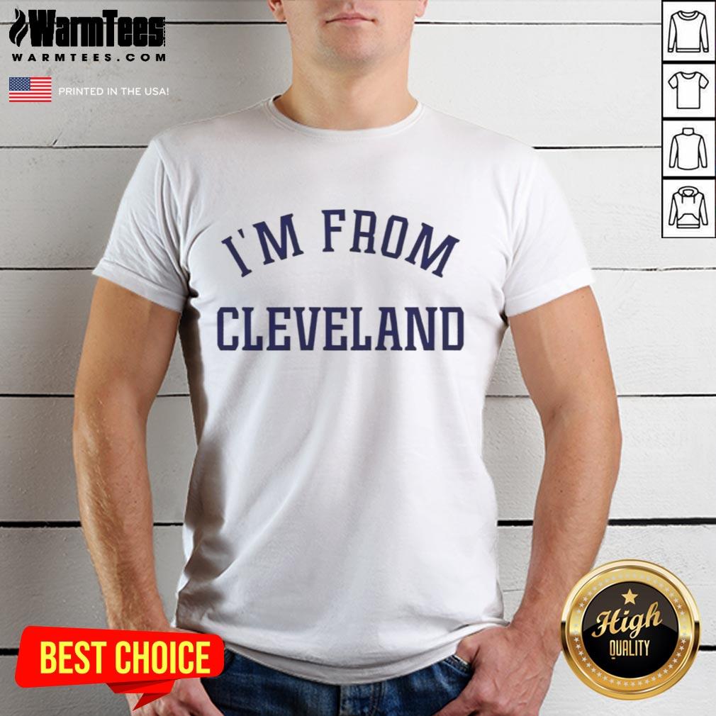 Alt Text: Travis Kelce smiling in a stylish I'M From Cleveland t-shirt, showcasing his love for Cleveland and sports fashion.