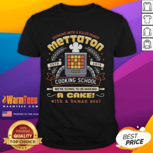 Alt Text: Official Mettaton Cooking School T-Shirt featuring a cake design with a human soul crest, perfect for fans.