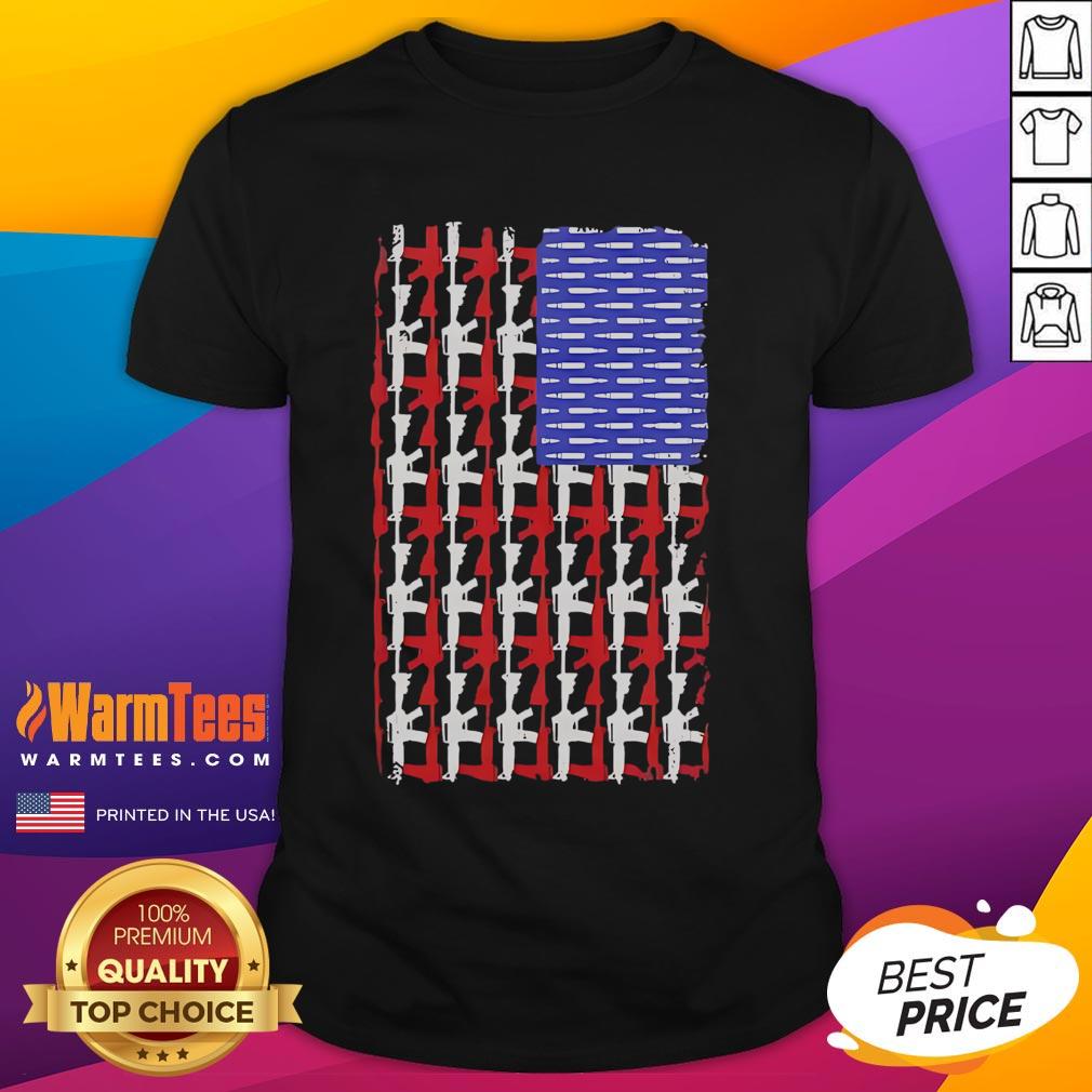 Alt Text: Official USA Guns and Bullets Flag T-Shirt featuring patriotic design with firearm graphics and vibrant colors.