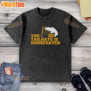 Alt Text: Premium The Tailgate Is Undefeated logo on a stylish washed t-shirt, perfect for game day and casual wear.