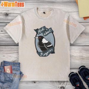 Alt Text: Top Mad About Magpies logo on a washed t-shirt, featuring a stylish design perfect for fans of the team.